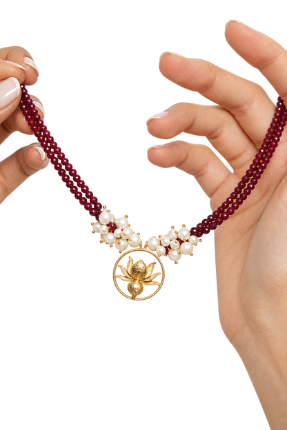 Ruby-Red Strands with the Lotus Pendant