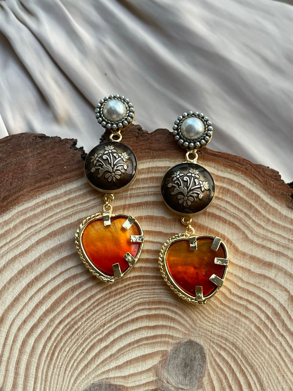 Orange flawless heart danglers