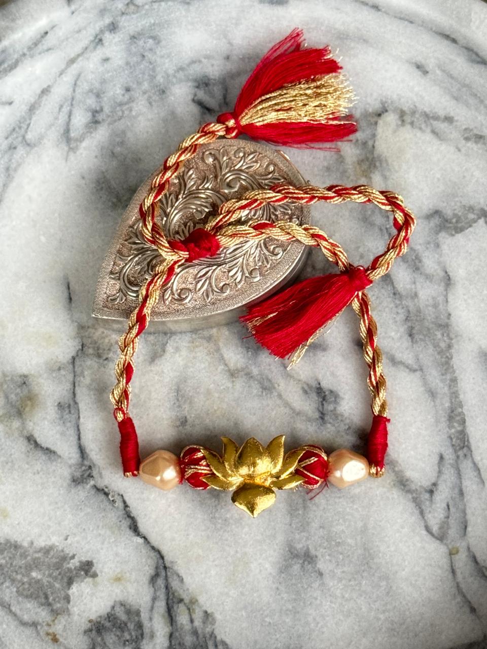 Signature lotus Rakhi | 18kt Gold Plated