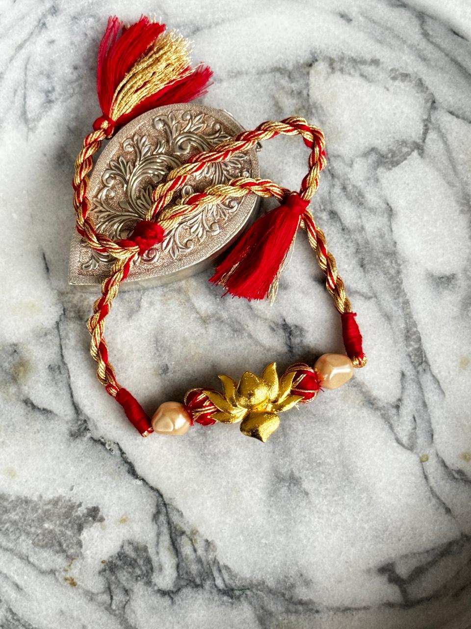 Signature lotus Rakhi | 18kt Gold Plated