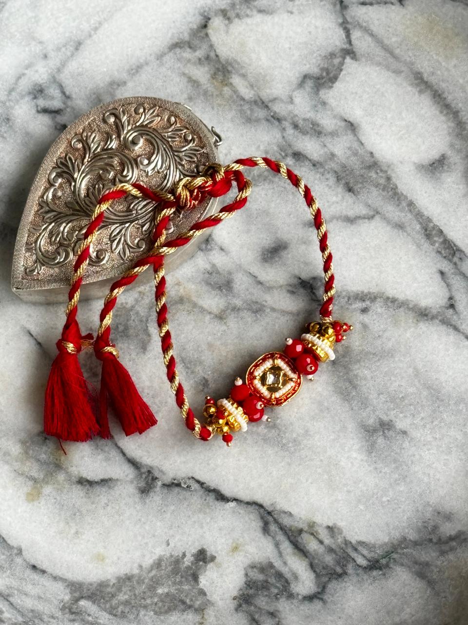 Red Stone Rakhi | 18kt Gold Plated