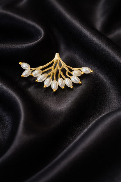 Roots brooch