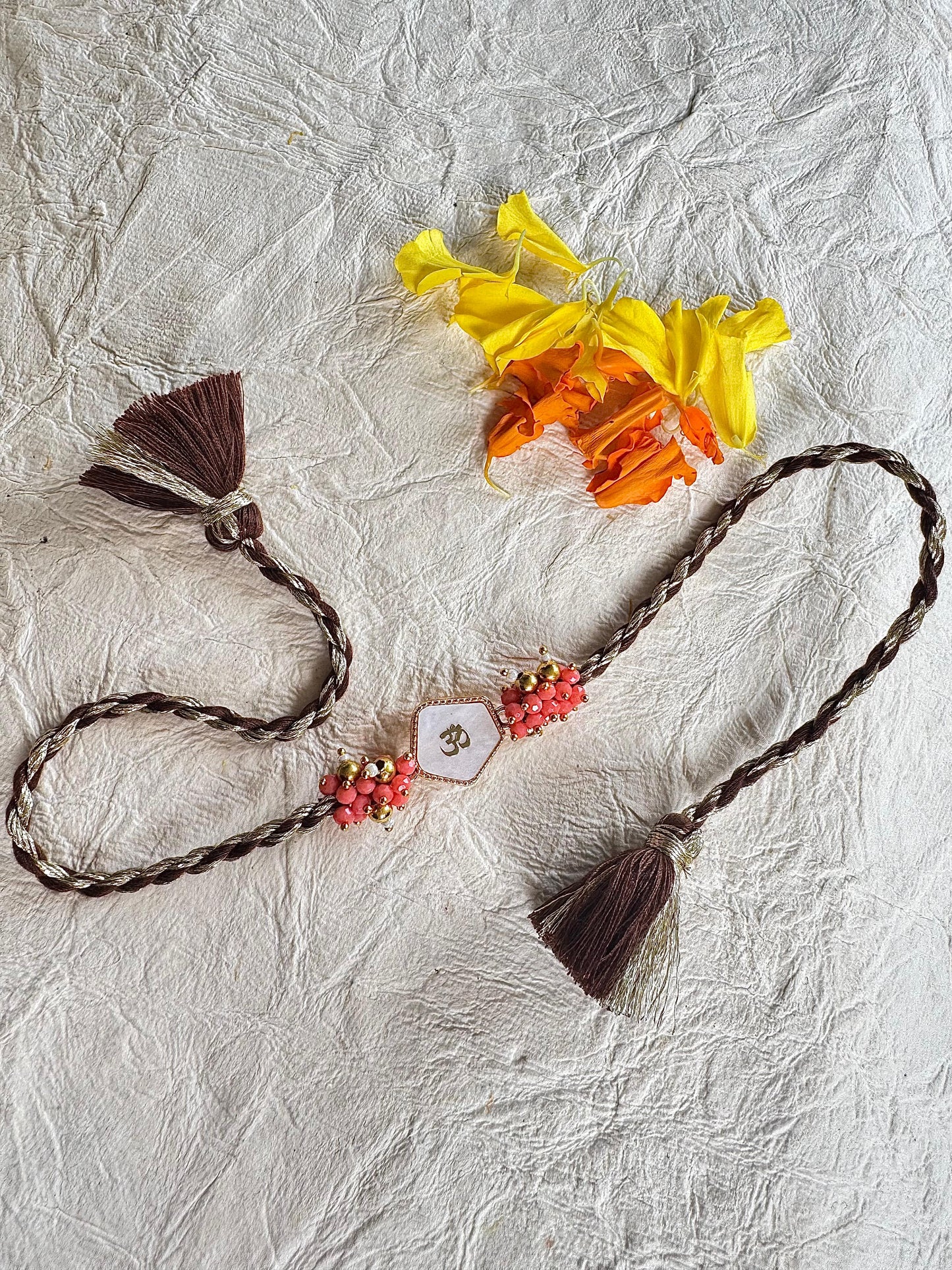 Om Coral Rakhi Duo